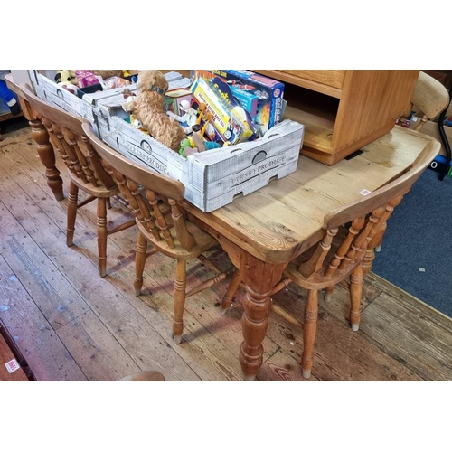 1101 - An old pine kitchen table and a set of eight beech and elm chairs, the table 180cm long. ... 