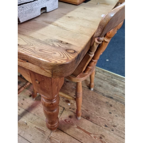 1101 - An old pine kitchen table and a set of eight beech and elm chairs, the table 180cm long. ... 