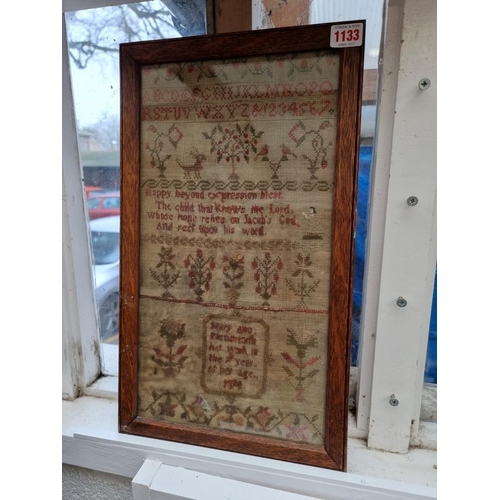 1133 - A 19th century needlework sampler, 42.5 x 22.5cm, (a.f.). 