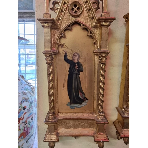 1186 - A pair of carved gilt wood tabernacle framed paintings of saints, 45 x 14cm. (2)