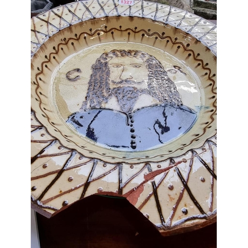 1327 - A slipware 'Charles I' charger, 42cm diameter, (a.f.).