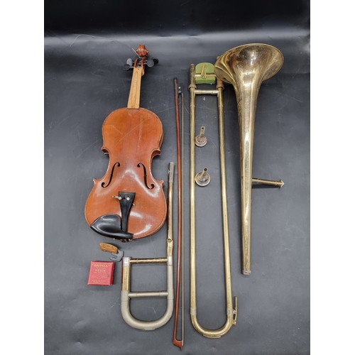 1800 - A Czechoslovakian clarinet in fitted case; together with a trombone, in case; and a violin, in case.... 