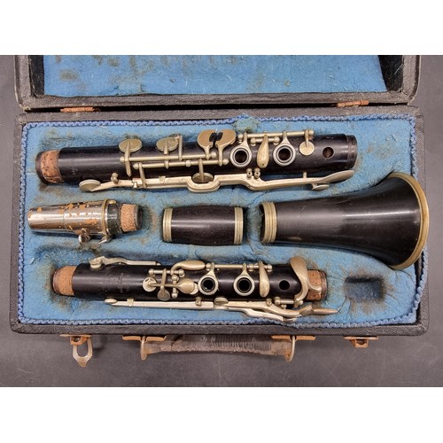 1800 - A Czechoslovakian clarinet in fitted case; together with a trombone, in case; and a violin, in case.... 