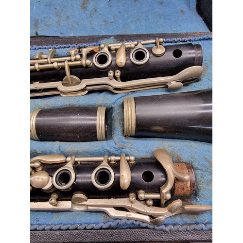 1800 - A Czechoslovakian clarinet in fitted case; together with a trombone, in case; and a violin, in case.... 