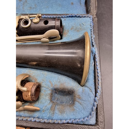 1800 - A Czechoslovakian clarinet in fitted case; together with a trombone, in case; and a violin, in case.... 