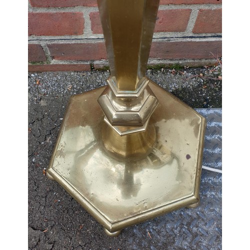 1050A - An old brass adjustable standard lamp, with hexagonal base.