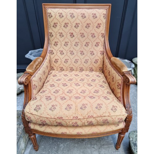 1085 - A Louis XVI style carved beech fauteuil. 