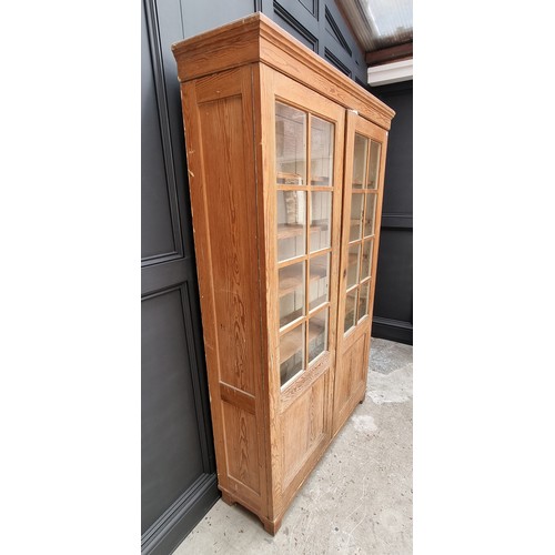 1026 - A Victorian pitch pine bookcase, 124cm wide. 