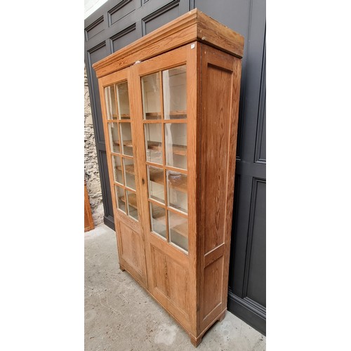 1026 - A Victorian pitch pine bookcase, 124cm wide. 