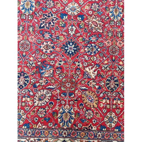 1000 - A Persian carpet, having allover floral decoration to central field, with floral borders, 295 x 200c... 