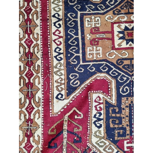 1002 - An old Karabakh rug, 198 x 148cm. 