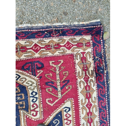 1002 - An old Karabakh rug, 198 x 148cm. 