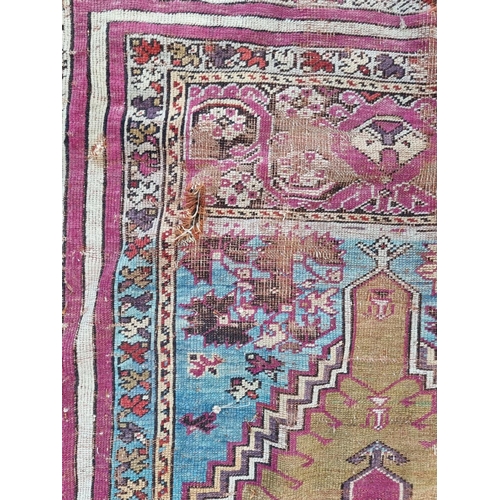 1011 - A Persian rug, having temple design to central field, with floral and geometric borders, 173 x ... 