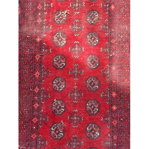 1019 - A Bokhara runner, having repeated geometric design, 289 x 96cm.