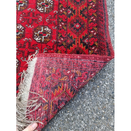 1020 - A Bokhara runner, having repeated geometric design, 290 x 82cm.