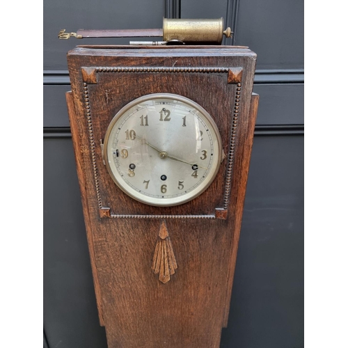 1024 - A 1930s Art Deco walnut and coromandel crossbanded grandmother clock, 139cm high; together with anot... 