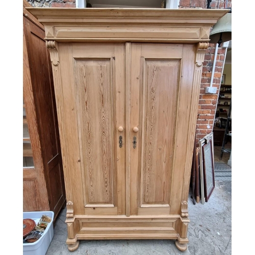 1025 - A late 19th century Continental pine armoire, 118cm wide.