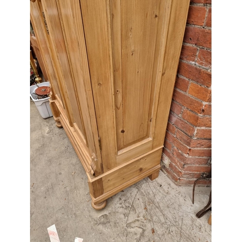 1025 - A late 19th century Continental pine armoire, 118cm wide.