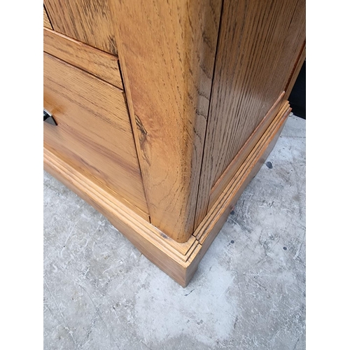 1027 - A contemporary oak bookcase, 90cm wide. 