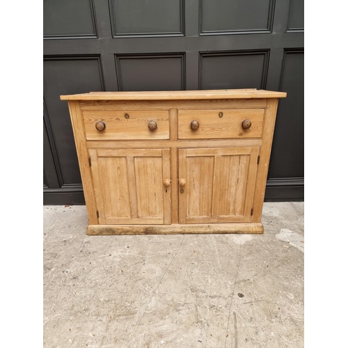 1032 - An old pine side cabinet, 128cm wide. 