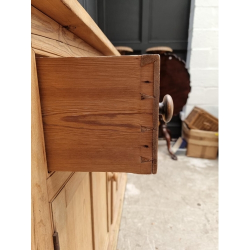 1032 - An old pine side cabinet, 128cm wide. 