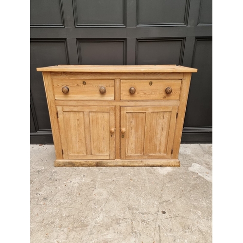 1032 - An old pine side cabinet, 128cm wide. 