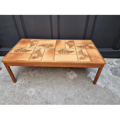 1033 - A vintage mid-century Danish teak and tile rectangular low occasional table, by Trioh, 125cm wide.... 