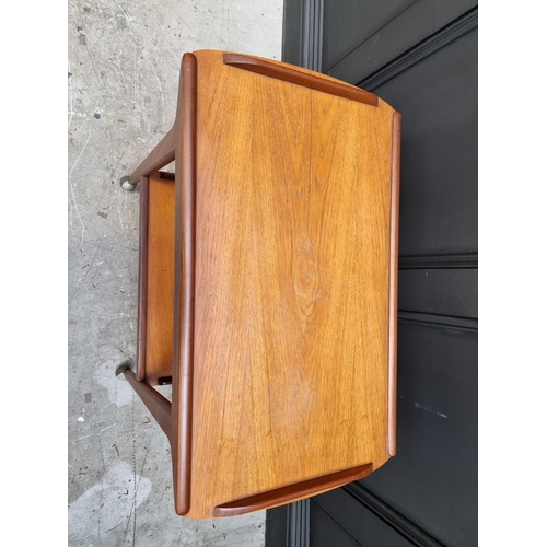 1035 - A mid-century teak trolley, 74.5cm wide.