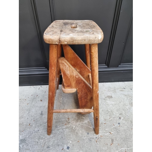1036 - A beech metamorphic stool. 