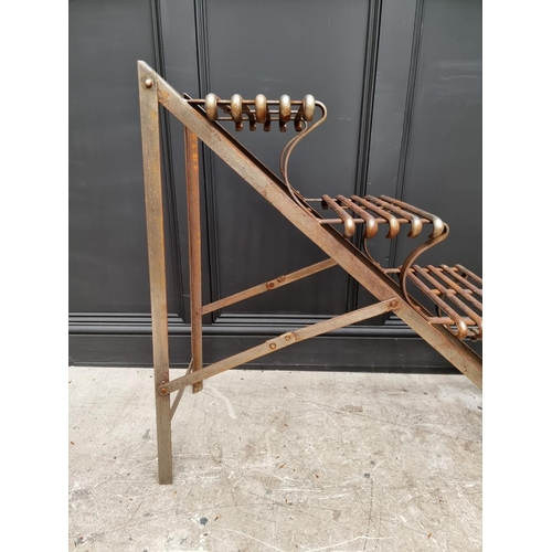 1042 - An Arras style steel plant stand, of ladder form, 88cm high x 107cm deep. 