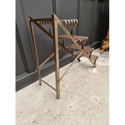 1042 - An Arras style steel plant stand, of ladder form, 88cm high x 107cm deep. 