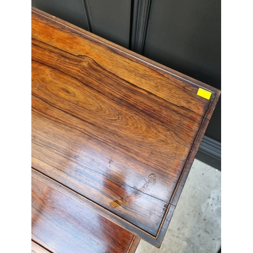 1050 - A nest of three rosewood occasional tables, largest 51.5cm wide. 