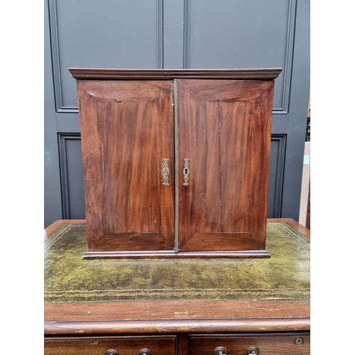 1053 - An 18th century mahogany table cabinet, enclosing pigeonholes and small drawers, 61cm high x 64.5cm ... 