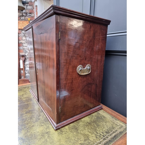 1053 - An 18th century mahogany table cabinet, enclosing pigeonholes and small drawers, 61cm high x 64.5cm ... 