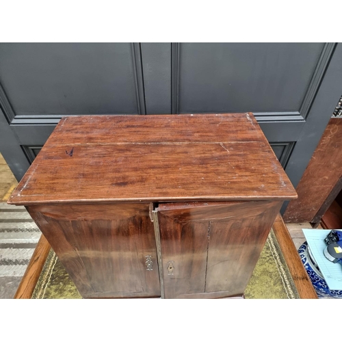 1053 - An 18th century mahogany table cabinet, enclosing pigeonholes and small drawers, 61cm high x 64.5cm ... 
