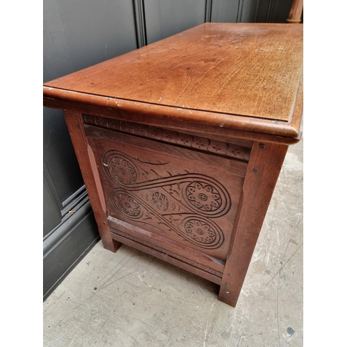 1055 - An antique carved walnut coffer, 97cm wide, 