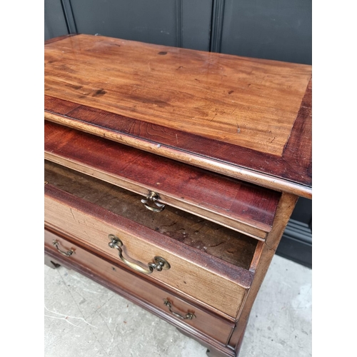 1059 - A small George III mahogany and crossbanded four drawer chest, with brushing slide, 87cm wide.... 