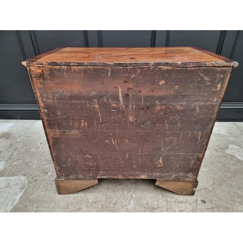 1059 - A small George III mahogany and crossbanded four drawer chest, with brushing slide, 87cm wide.... 