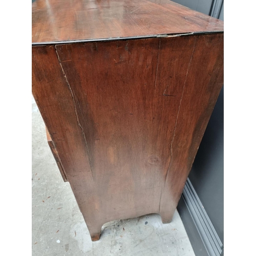 1061 - A Regency mahogany bowfront chest of drawers, 91cm wide.  