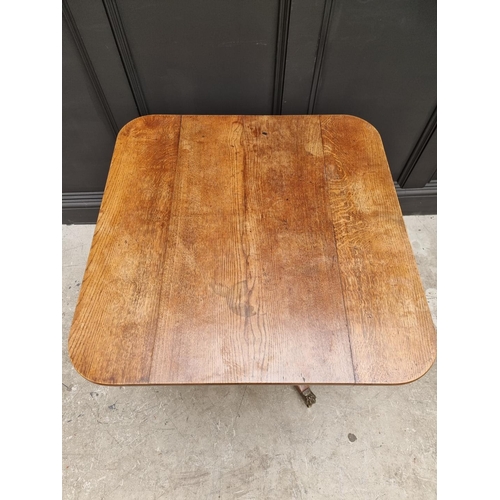 1063 - A 19th century oak tilt top tripod table, 81cm wide.