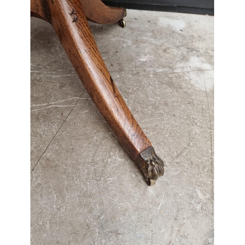 1063 - A 19th century oak tilt top tripod table, 81cm wide.