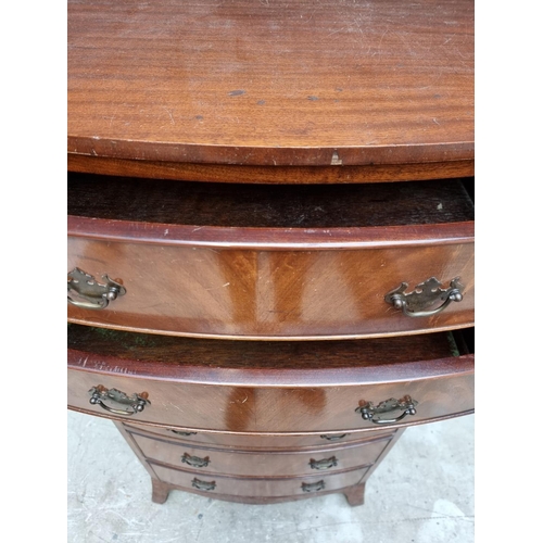 1065 - A reproduction mahogany bowfront chest of drawers, 62cm wide.