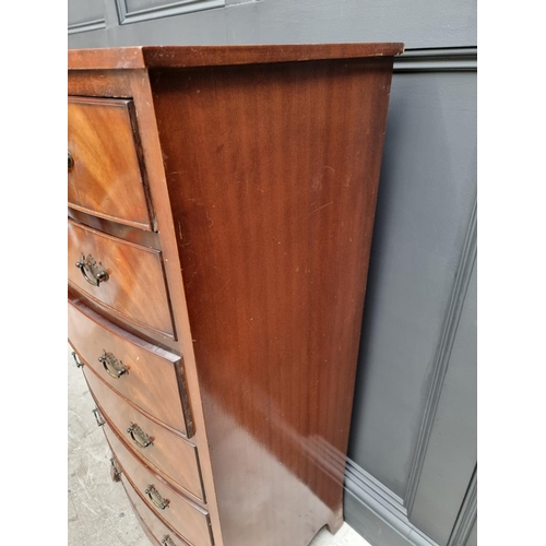 1065 - A reproduction mahogany bowfront chest of drawers, 62cm wide.