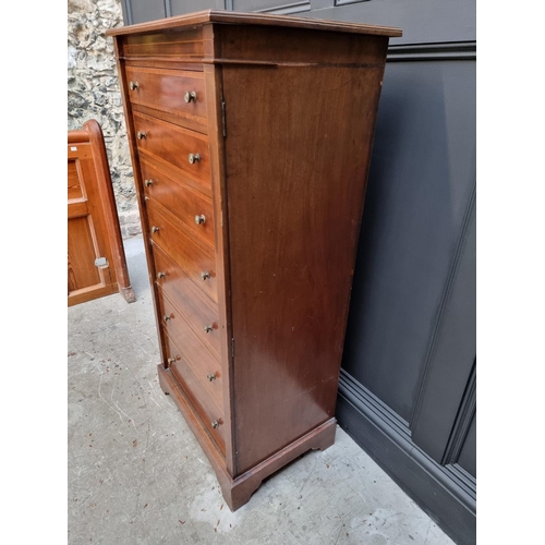 1066 - A late Victorian mahogany and satinwood crossbanded Wellington chest, 60.5cm wide.  ... 