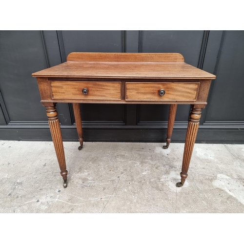 1067 - A Regency mahogany two drawer side table, possibly Gillows, 86cm wide. 