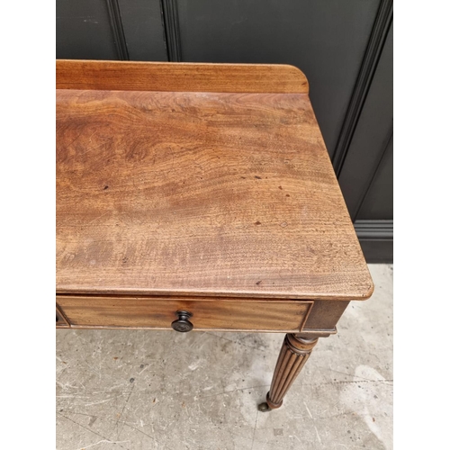 1067 - A Regency mahogany two drawer side table, possibly Gillows, 86cm wide. 