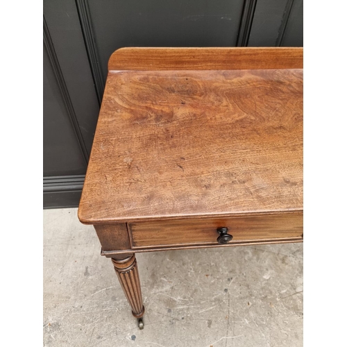 1067 - A Regency mahogany two drawer side table, possibly Gillows, 86cm wide. 