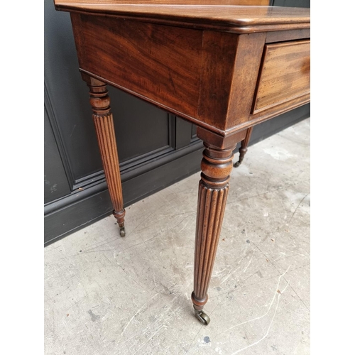 1067 - A Regency mahogany two drawer side table, possibly Gillows, 86cm wide. 