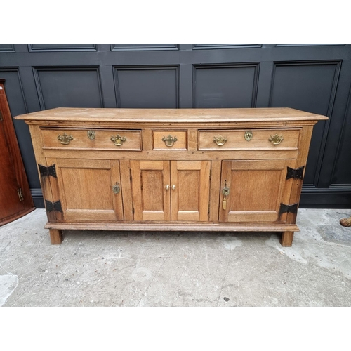 1072 - A 19th century oak dresser base, 180cm wide.