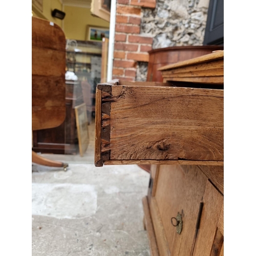 1072 - A 19th century oak dresser base, 180cm wide.